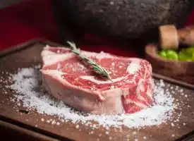 raw meat on brown wooden chopping board
