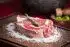 raw meat on brown wooden chopping board